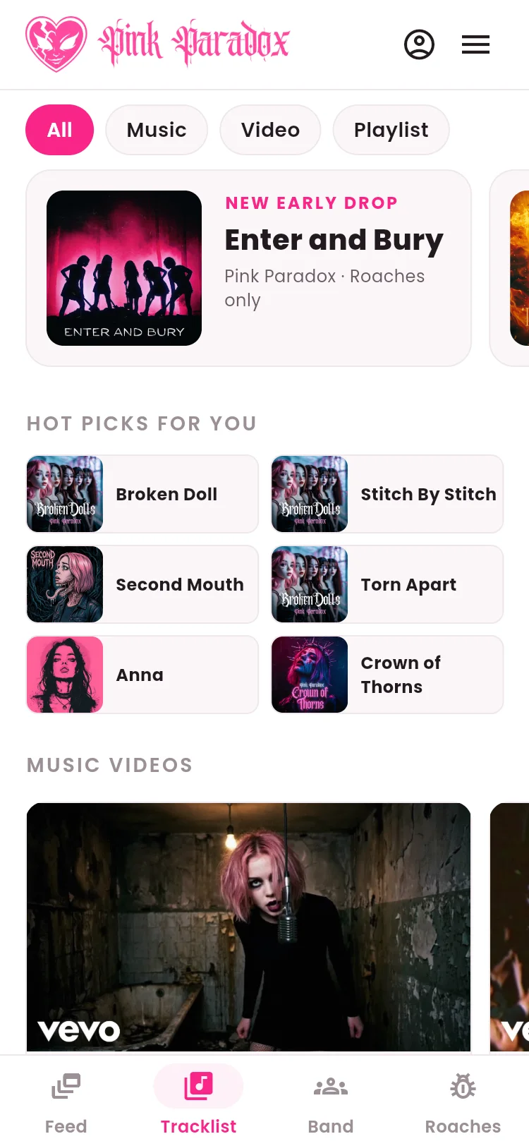 The Tracklist screen in the Pink Paradox app: filter chips for All, Music, Video and Playlist, the new early drop Enter and Bury, Hot picks for you, and the music videos strip.